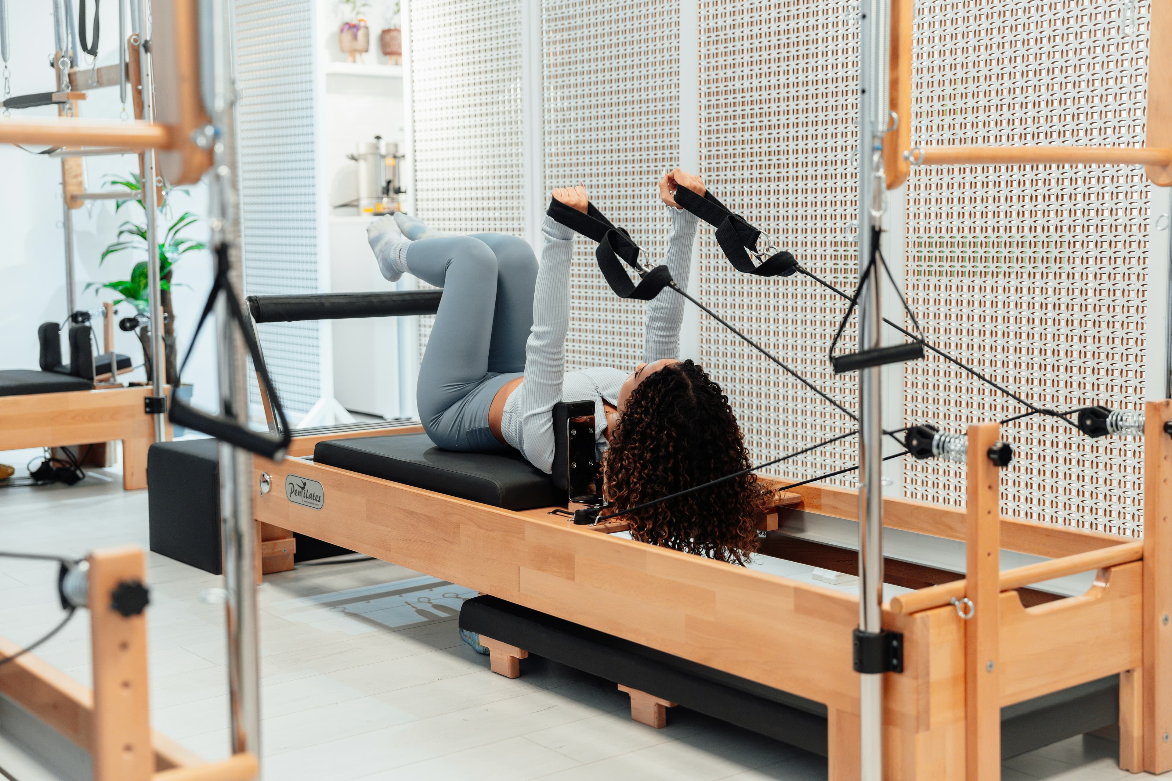 Pilates Reformer vs Mat: Key Differences Explained